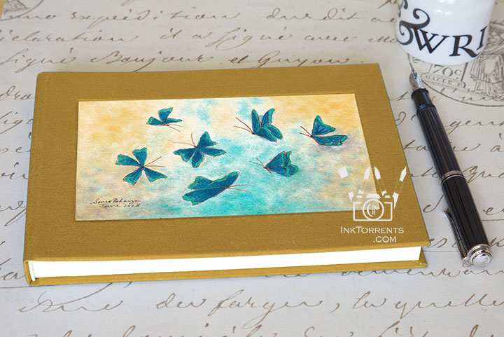 Muted Amber Yellow cloth-bound layflat notebook with The Blue Butterfly Effect art — InkTorrents Graphics