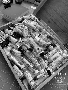 Old wooden box full of watercolors that I use.