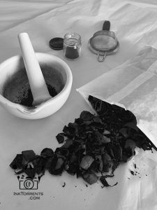 Grinding up dried walnut husks.