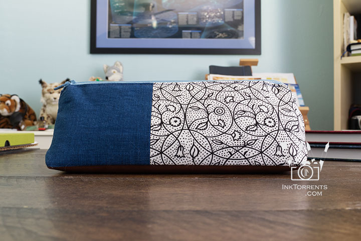 Handmade triangular zippered pencil case in printed cotton and faux leather, self-drafted pattern, by InkTorrents Graphics