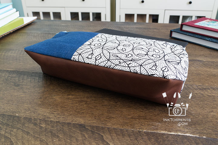 Handmade triangular zippered pencil case in printed cotton and faux leather, self-drafted pattern, by InkTorrents Graphics